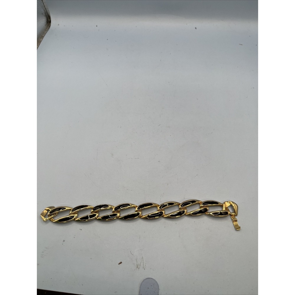 Gold Tone link bracelet with black accents